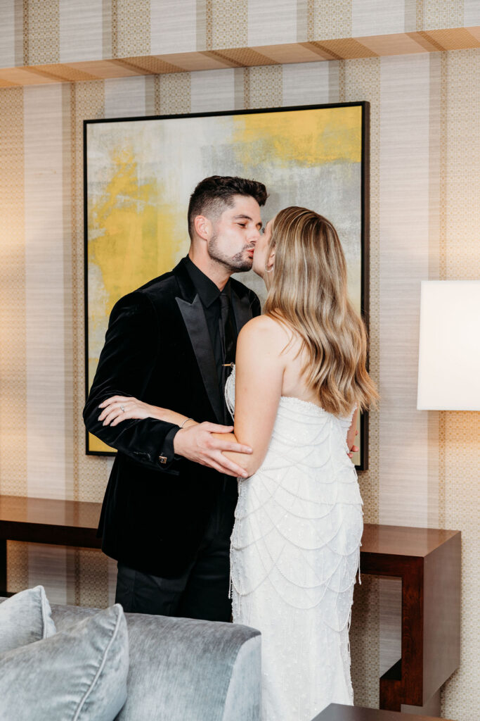 bride and groom kissing after their first look