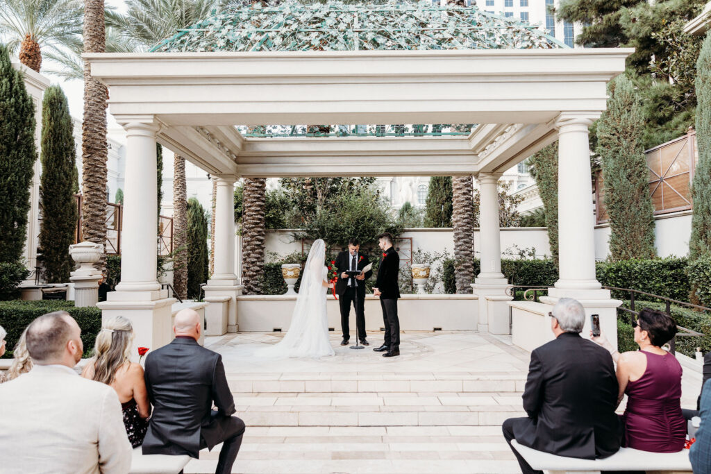 Bride and groom holding hands during their ceremony