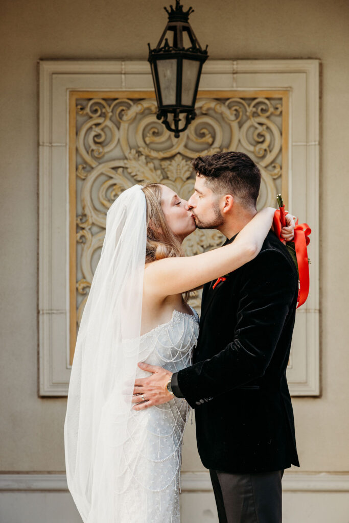 Portrait of the newly married couple kissing