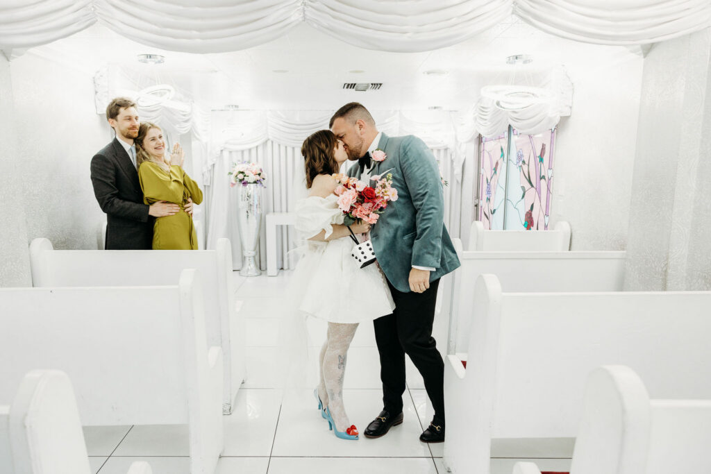 cute picture of the bride and groom kissing after the ceremony