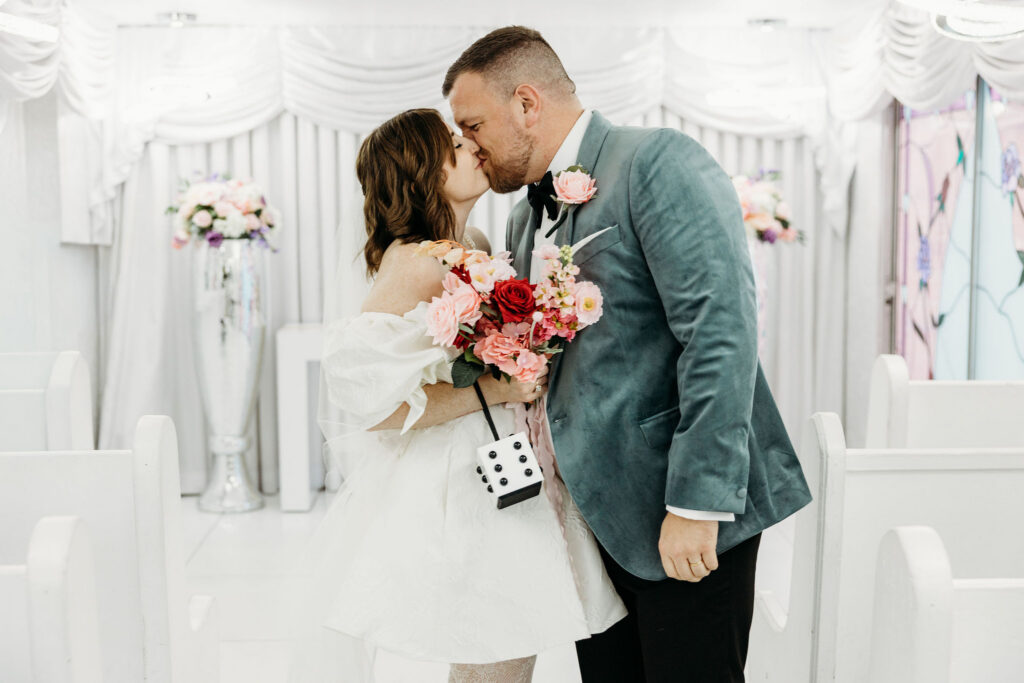 bride and groom kissing after the ceremony