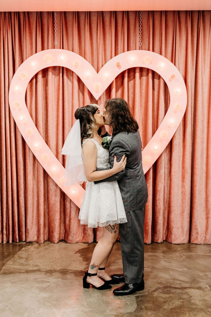 Bride and groom, kissing after their wedding ceremony