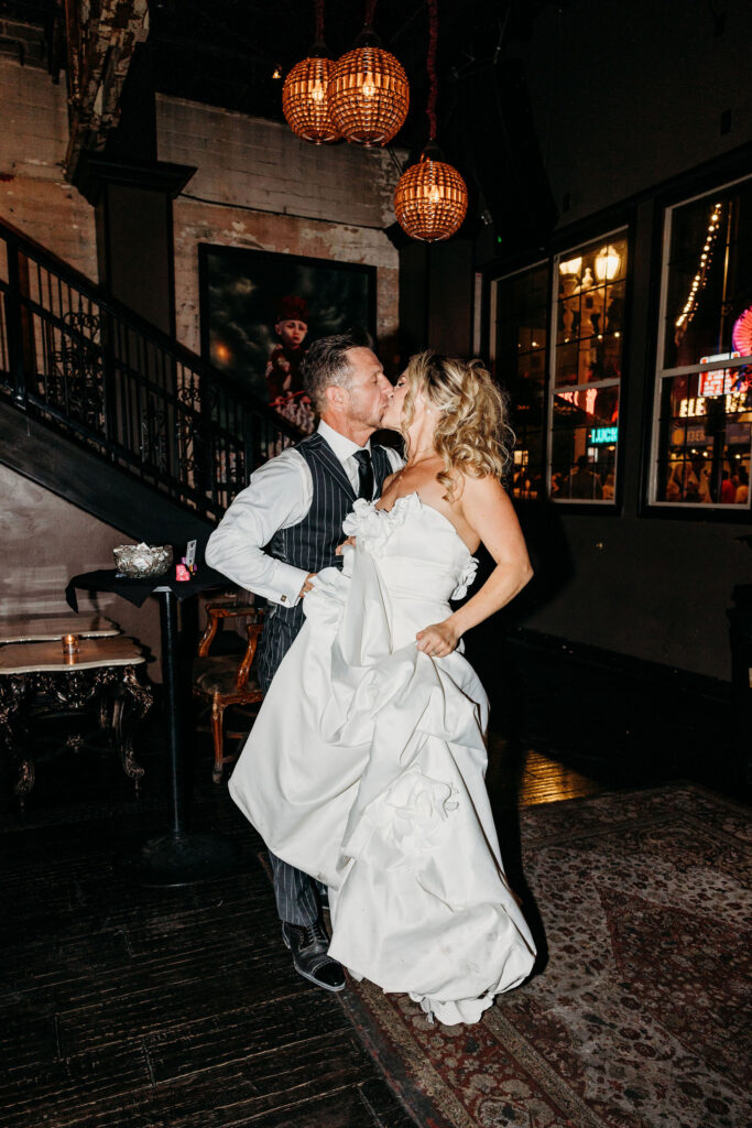 cute portrait of the newlyweds kissing