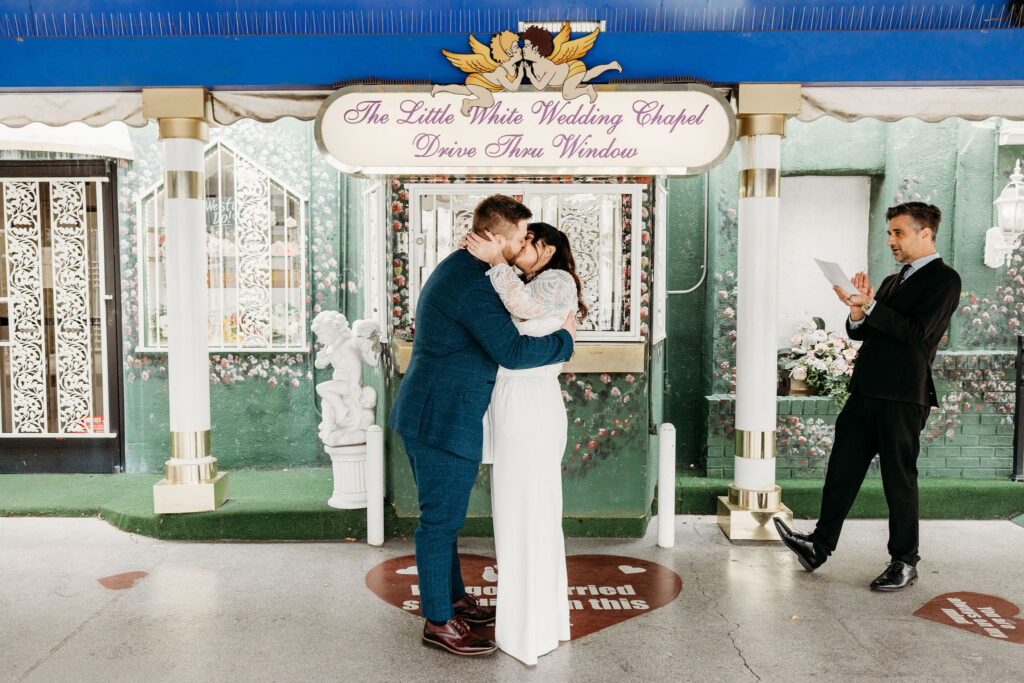 Cute picture of the newly married couple kissing after their ceremony