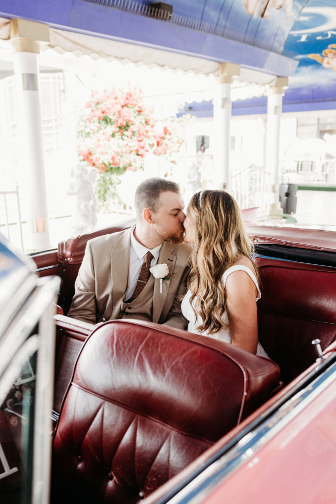 Newly married couple kissing after their ceremony
