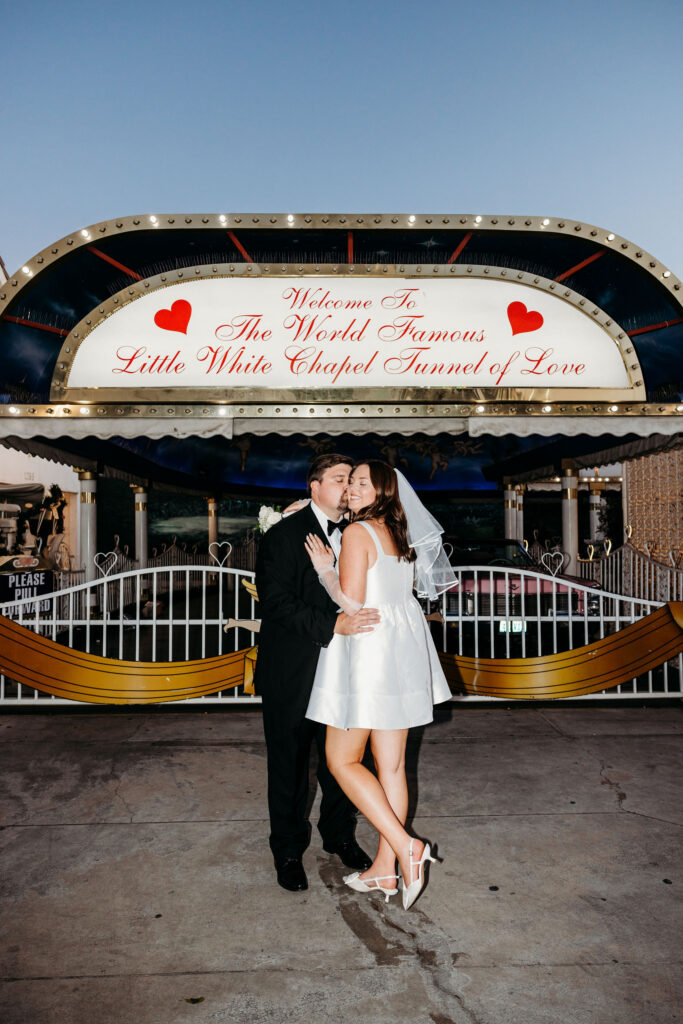groom kissing the bride on the cheek