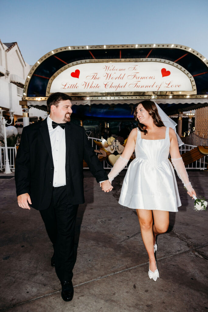 cute portrait of the newlyweds holding hands
