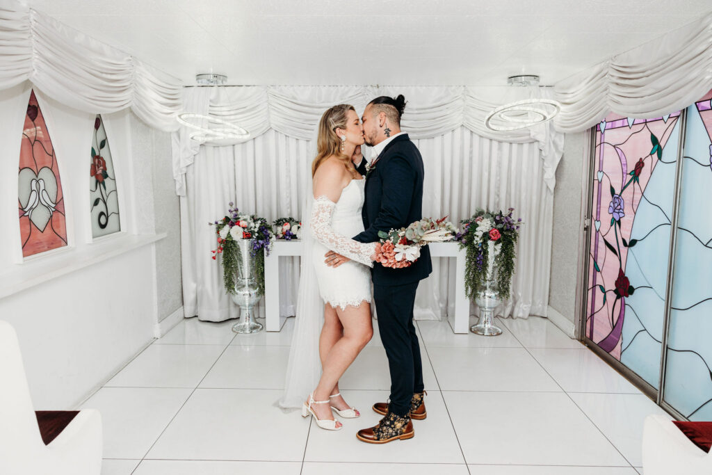 newlyweds kissing after their ceremony