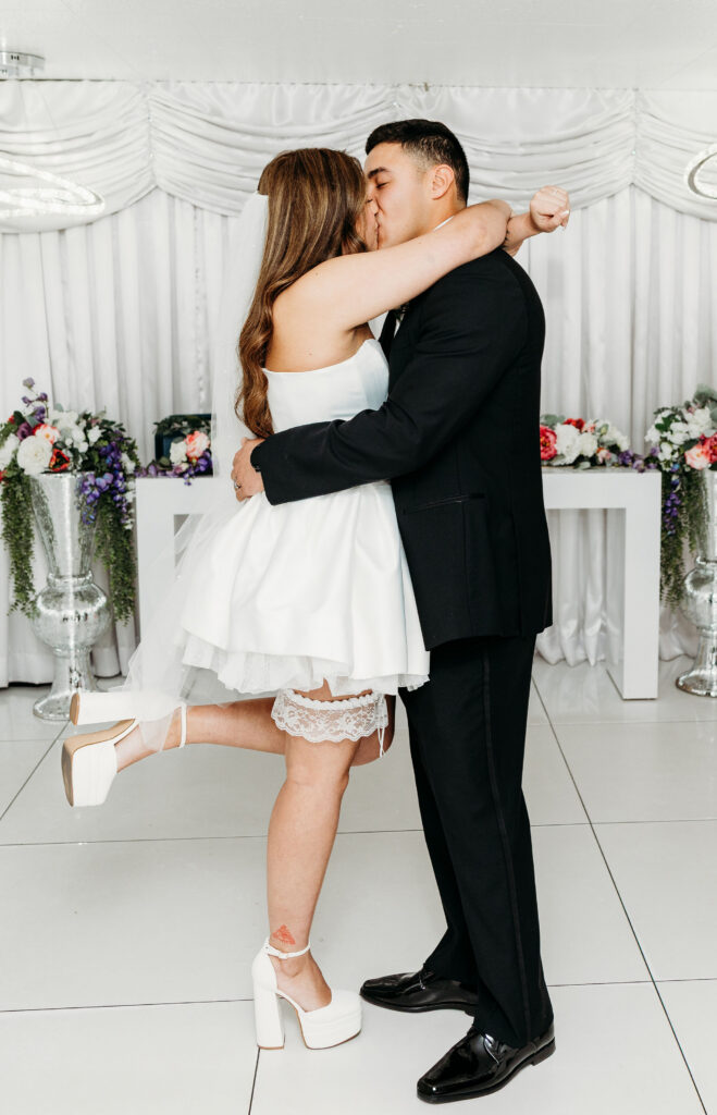 newlyweds kissing after their ceremony