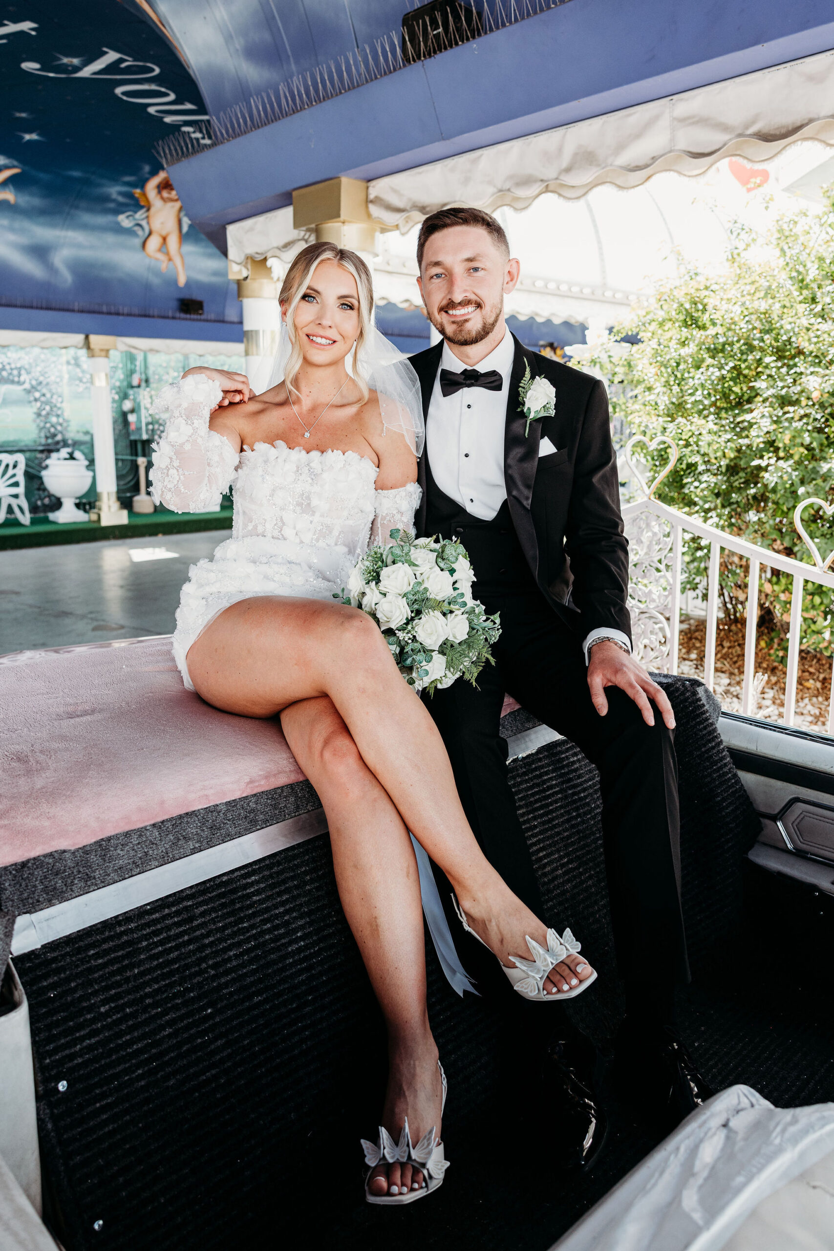 Couple smiling at the camera during their photo shoot