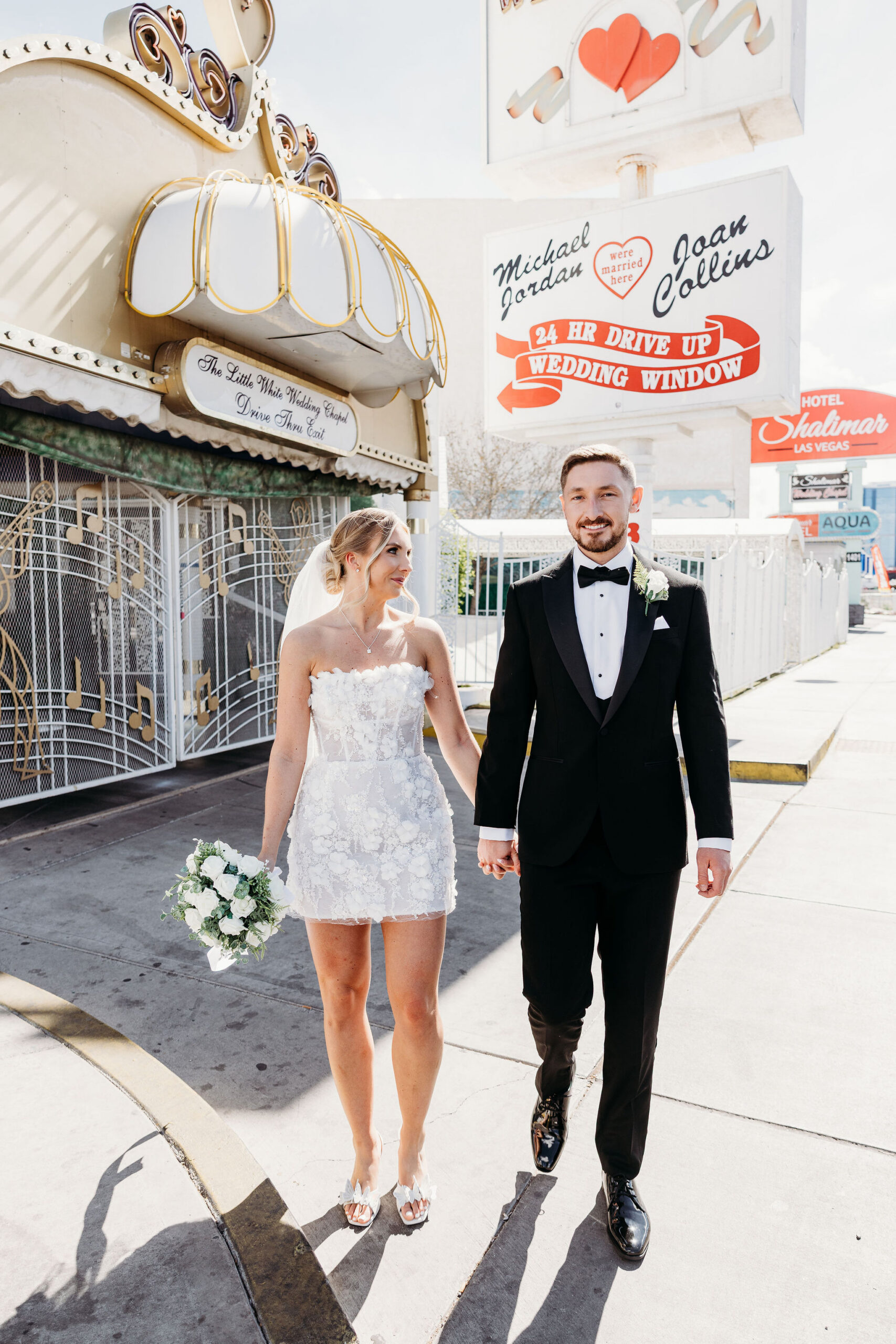 Bride and groom holding hands during their bridal portraits