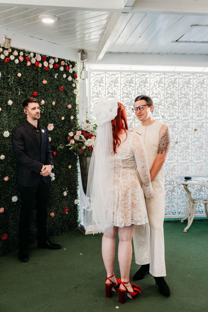 bride and groom holding hands during their wedding ceremony