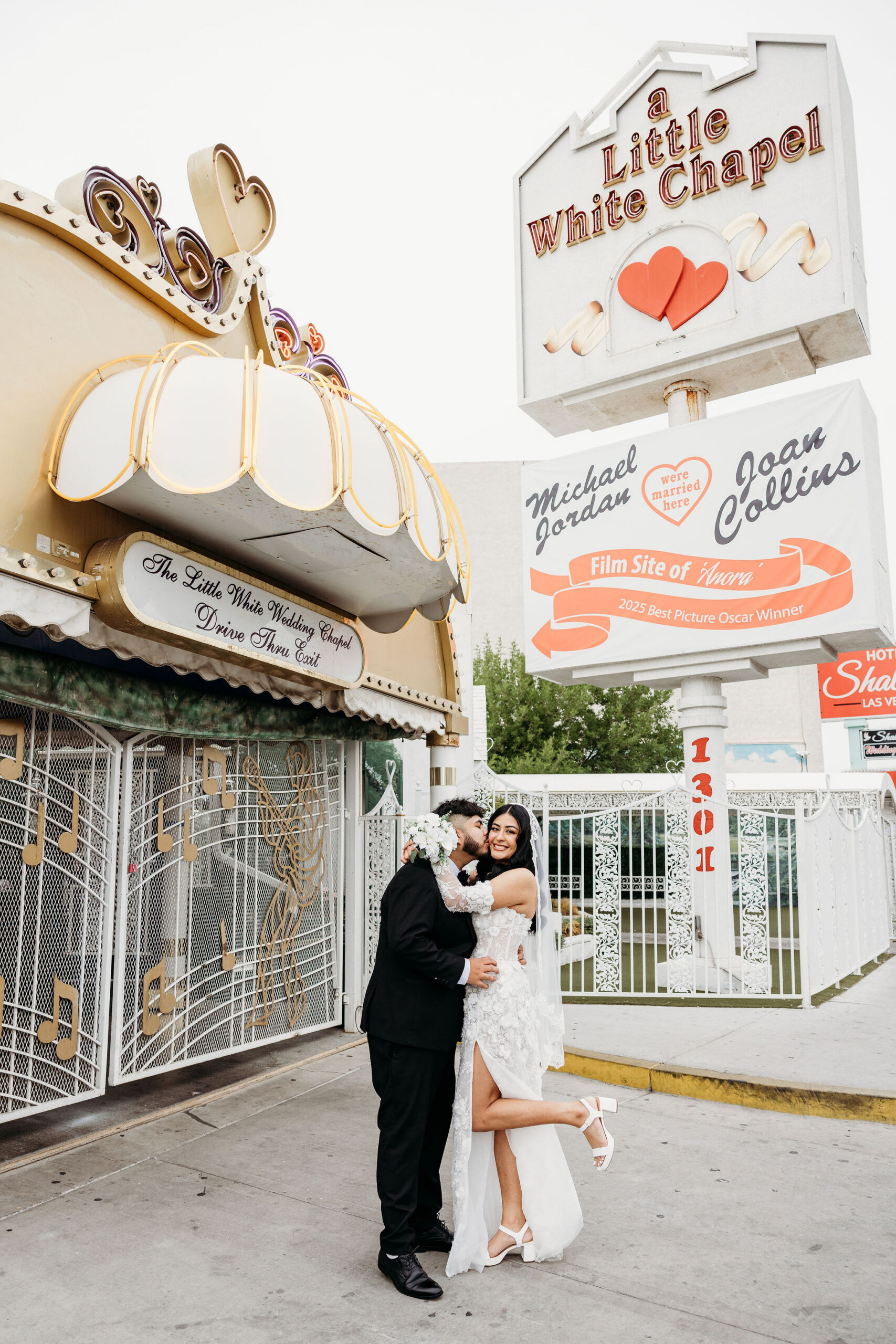 groom kissing the bride on the cheek