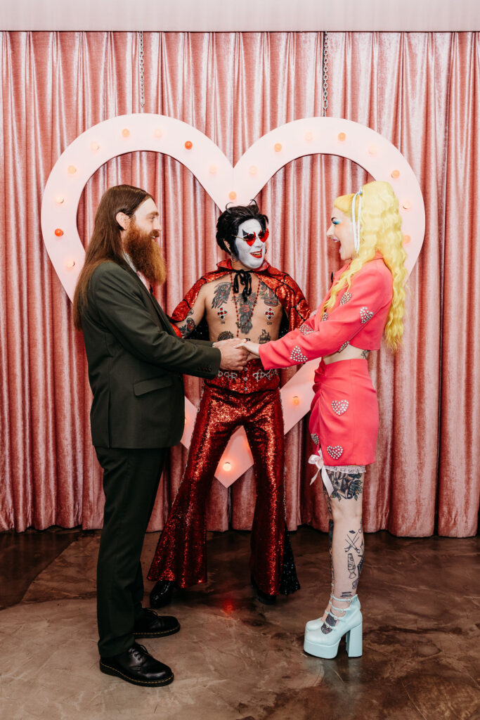 bride and groom holding hands during their wedding ceremony