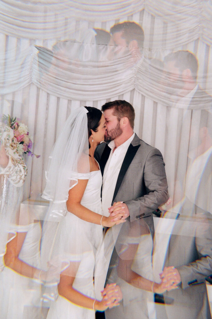 cute picture of the newlyweds kissing