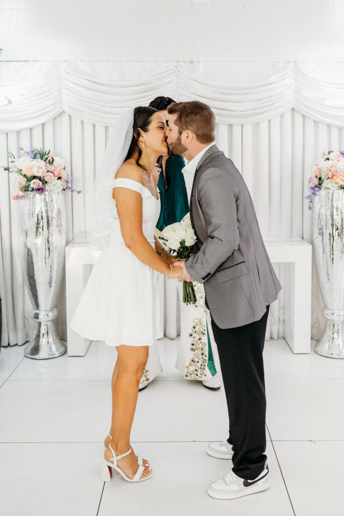 cute picture of the bride and groom kissing