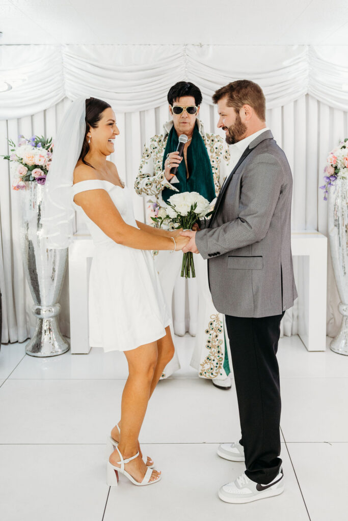 bride and groom holding hands during their ceremony