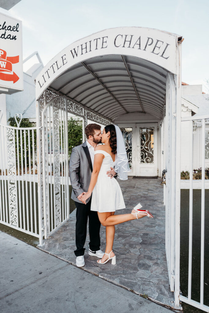 cute picture of the bride and groom kissing