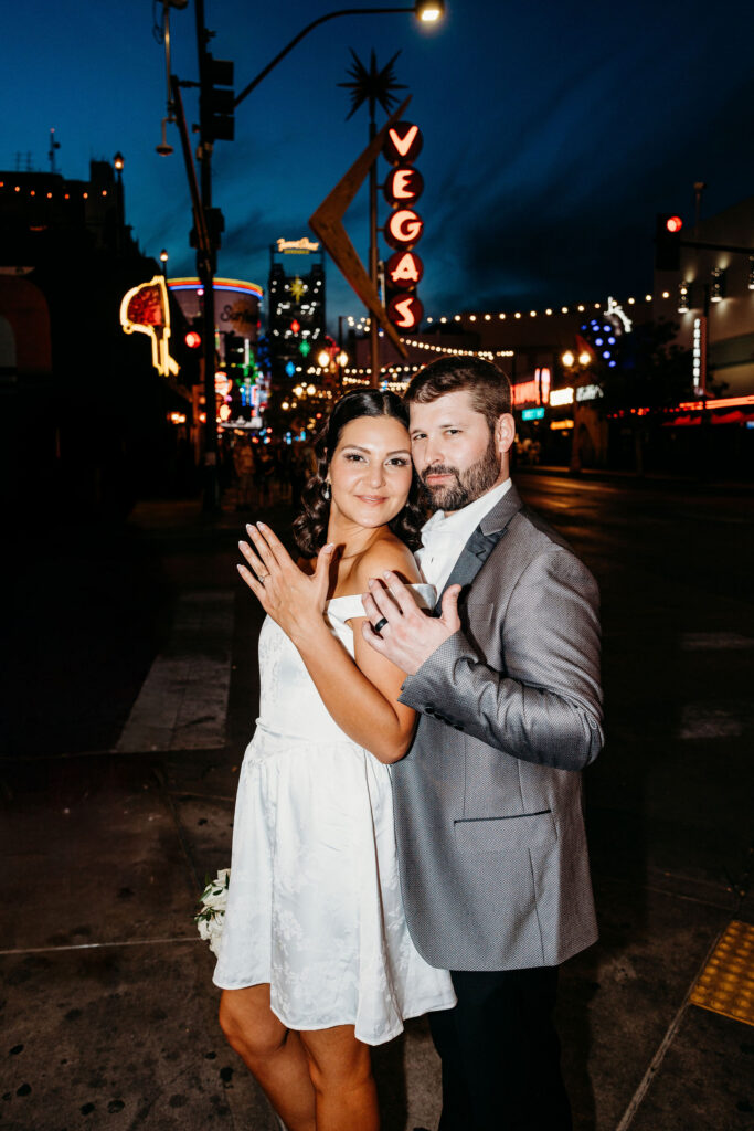 picture of the newlyweds showing their wedding rings