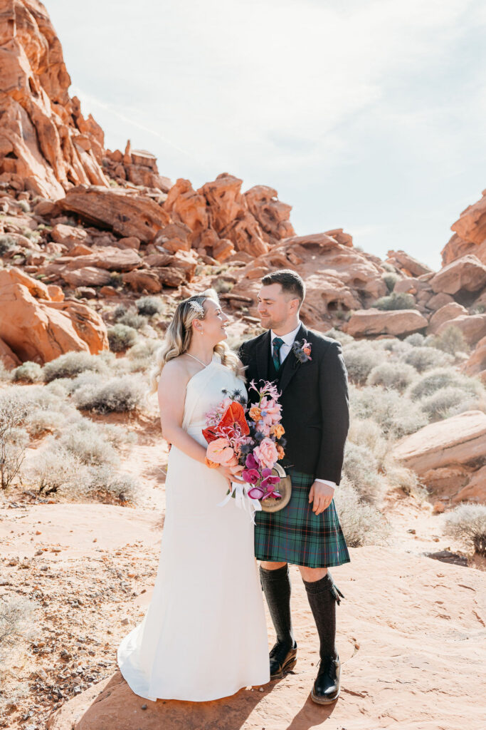 newlyweds smiling at each other