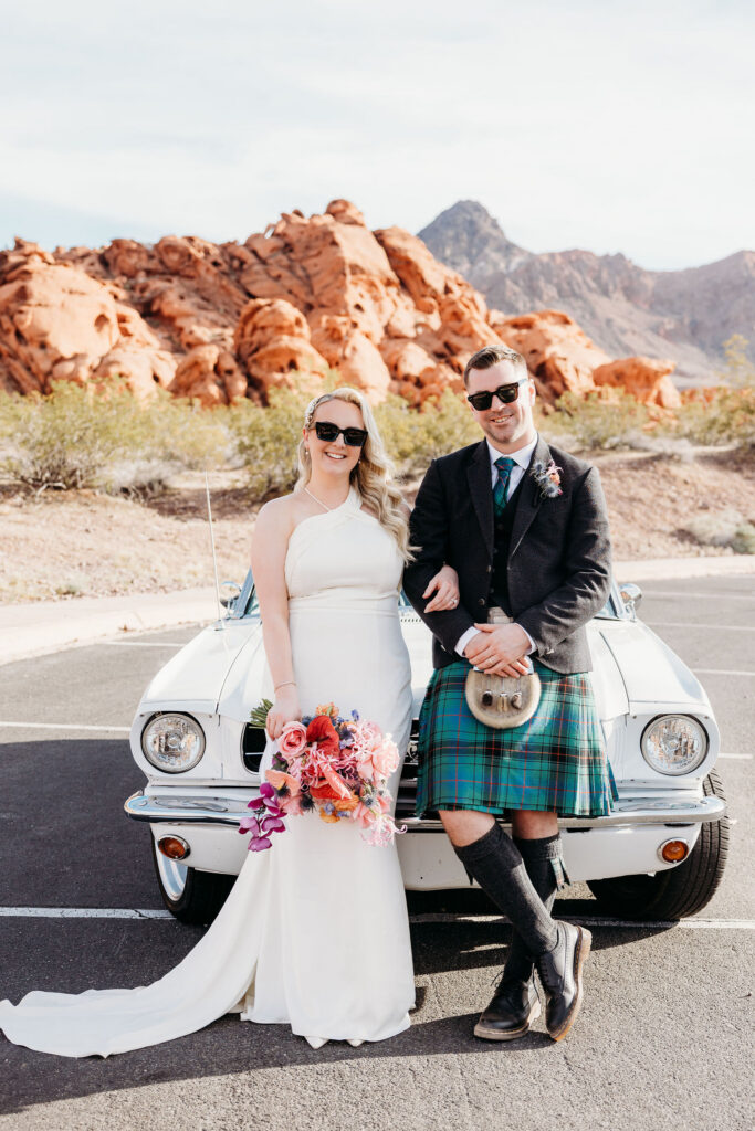 Couple smiling at the camera during their bridal portraits
