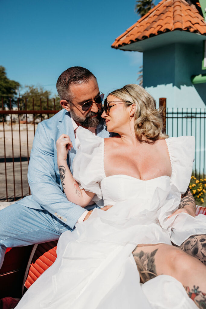 groom kissing the bride on the forehead