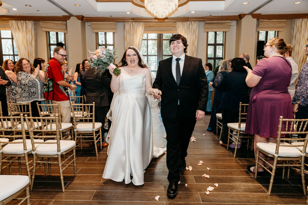 Newly married couple heading to their bridal portraits
