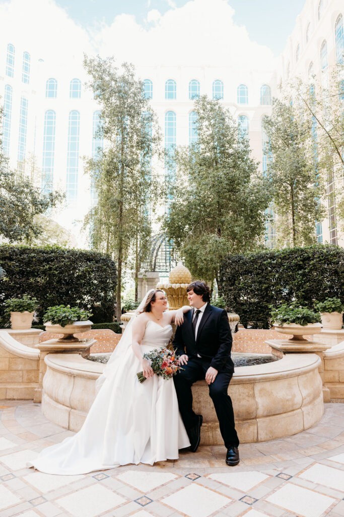 portrait of the bride and groom, smiling at each other