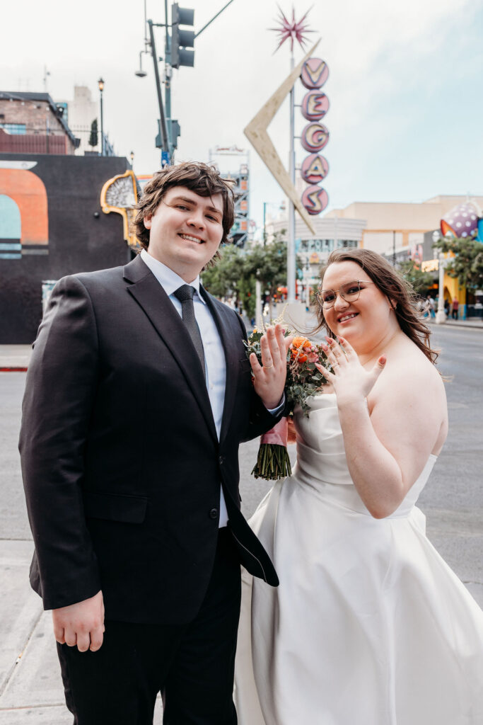 Newly married couple showing their wedding rings