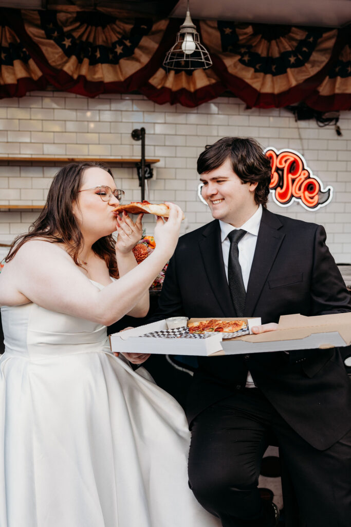 No married couple celebrating with pizza