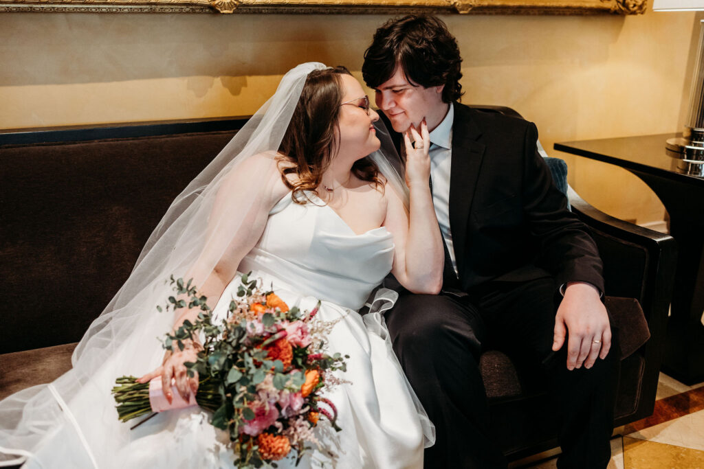 Portrait of the newly married couple smiling at each other