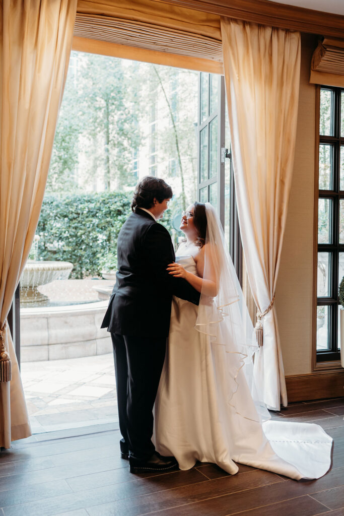 Picture of the married couple smiling at each other