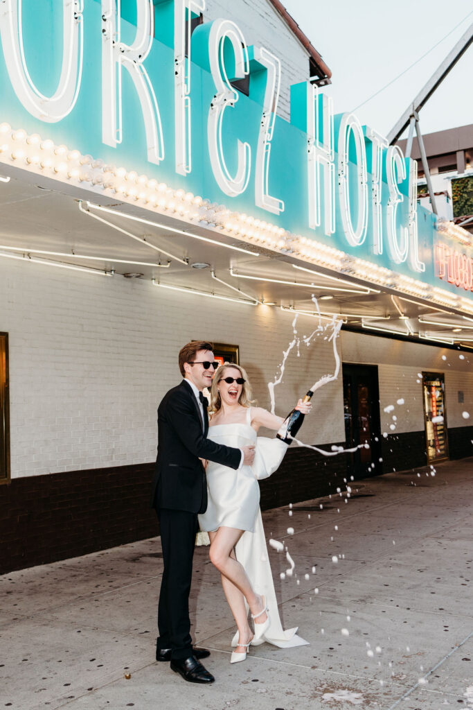 Couple celebrating their elopement with champagne
