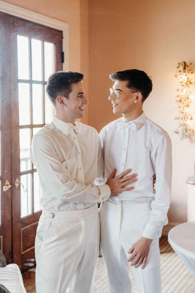 couple smiling at each other during their bridal session