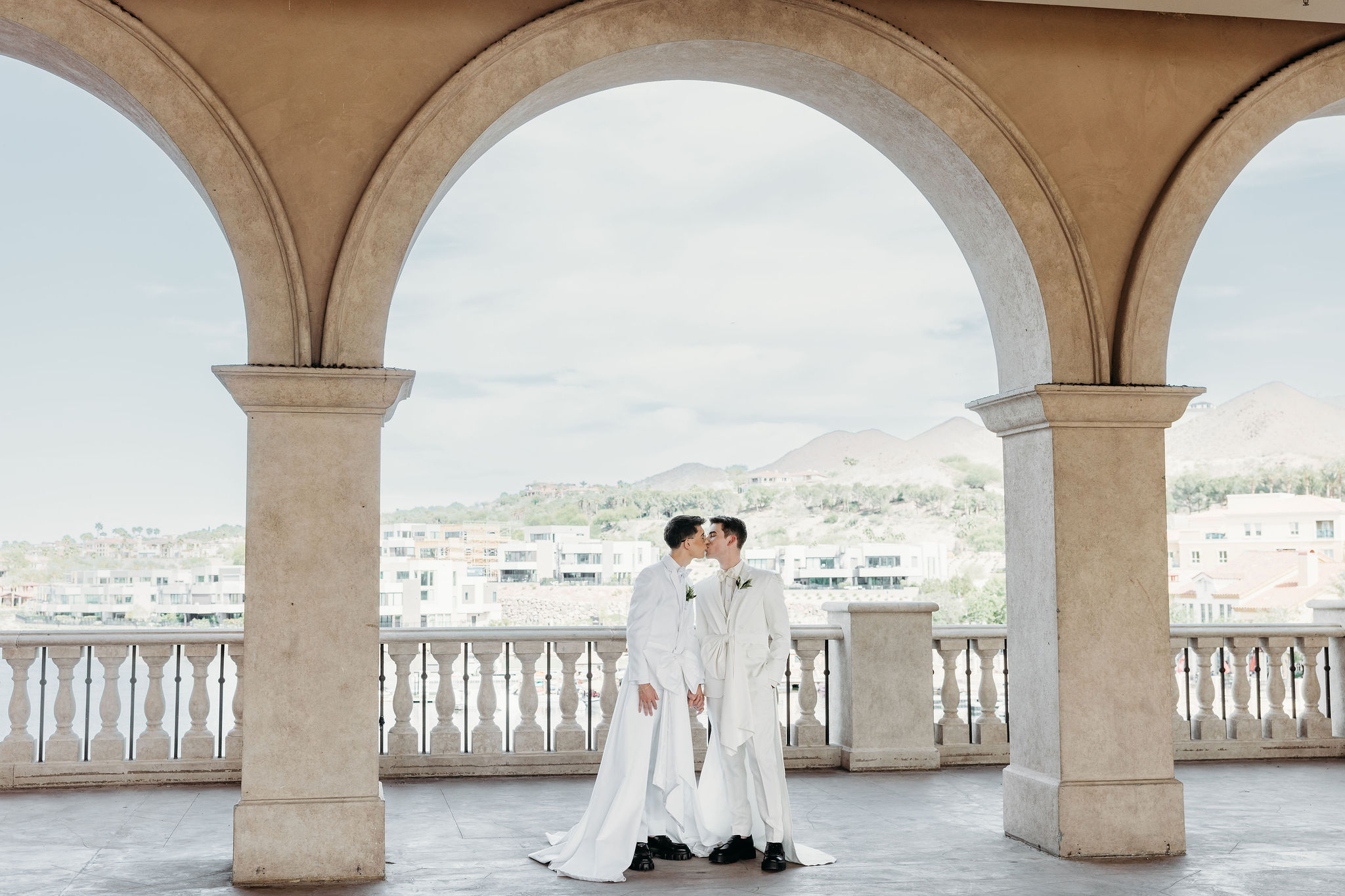 cute picture of the couple kissing during their photoshoot