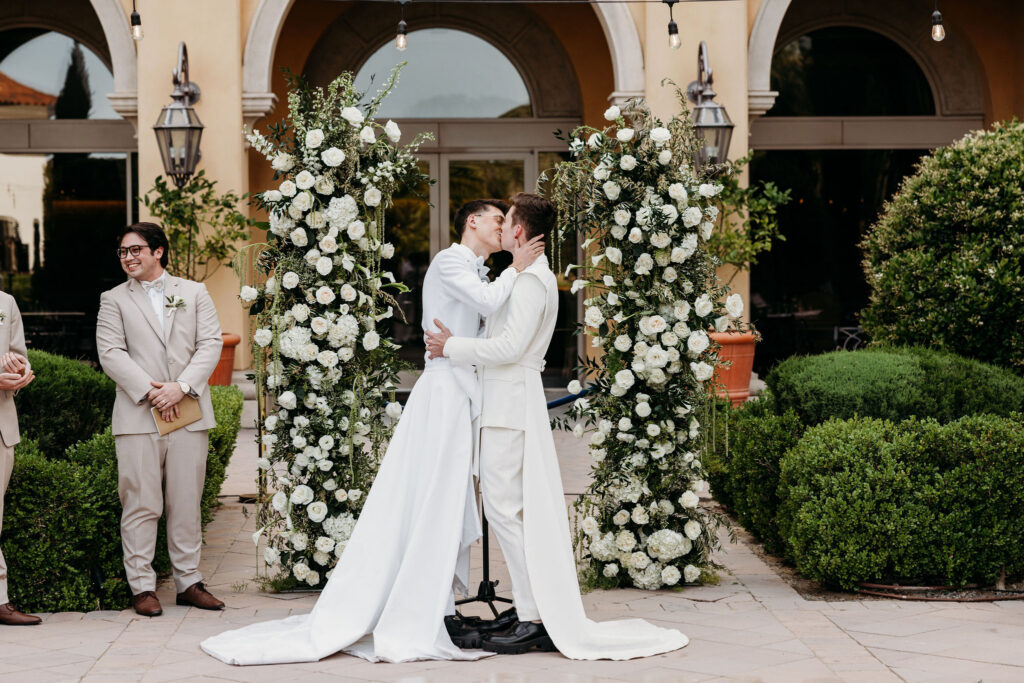 cute picture of the newlyweds kissing after their ceremony