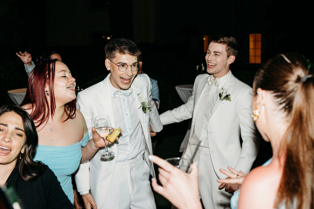 newlyweds having the best time at their wedding reception party