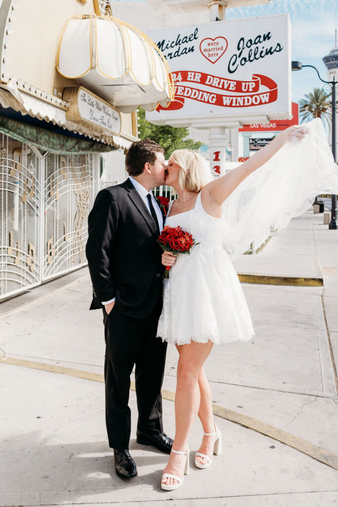 cute picture of the bride and groom kissing
