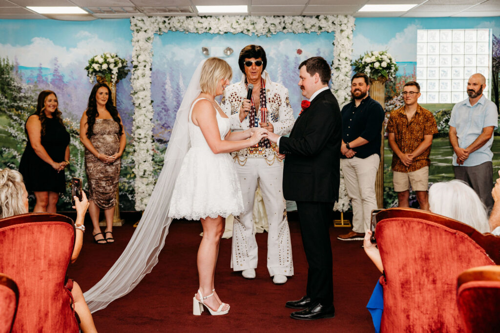 bride and groom holding hands during their wedding ceremony