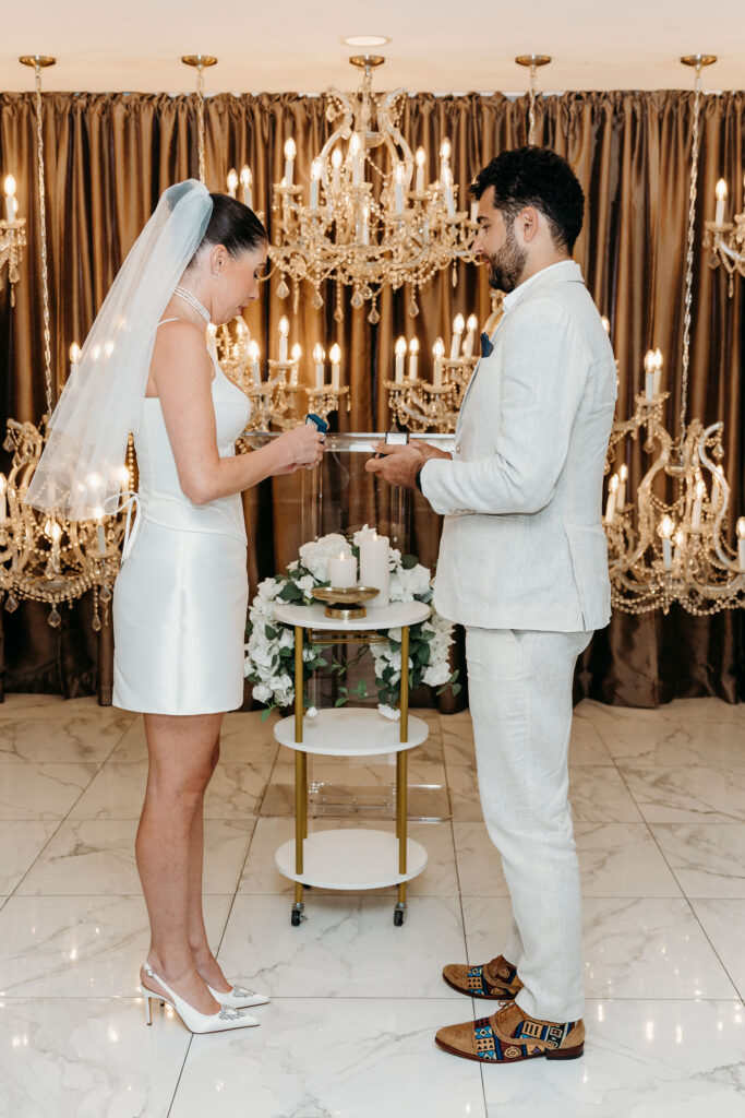 bride and groom holding hands during their ceremony