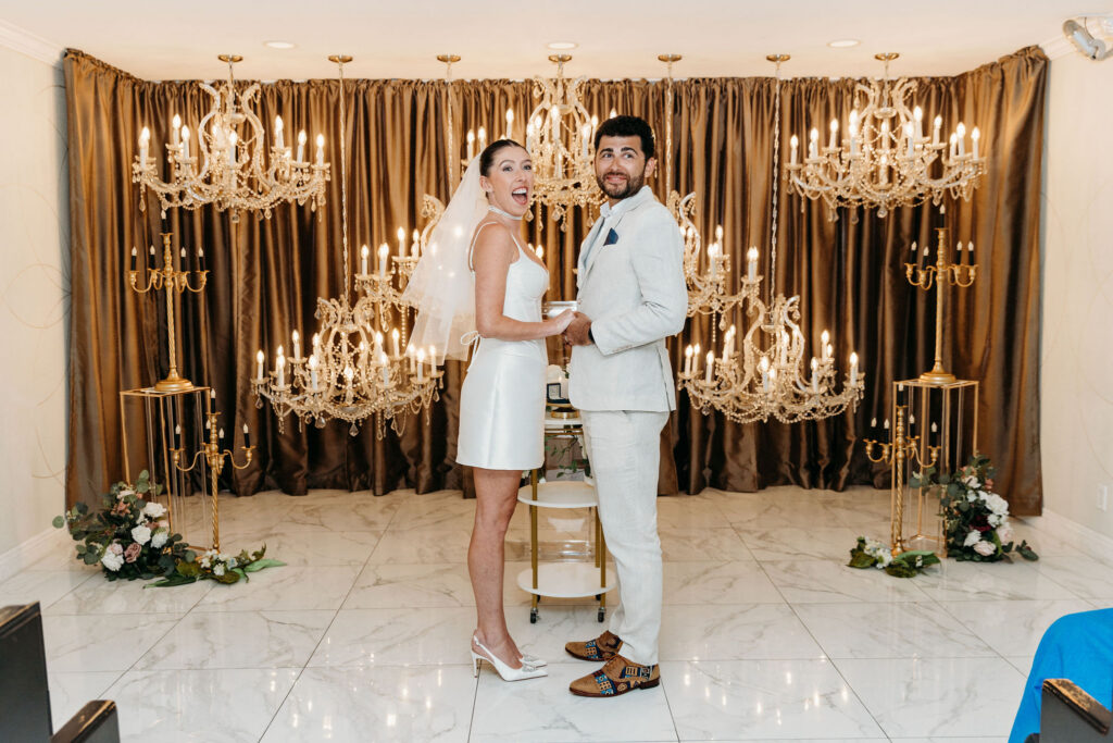 couple smiling at the camera during their photoshoot