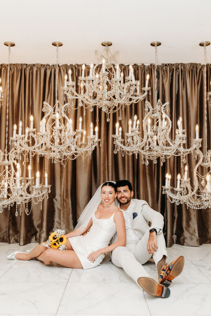 couple smiling at the camera during their bridal portraits