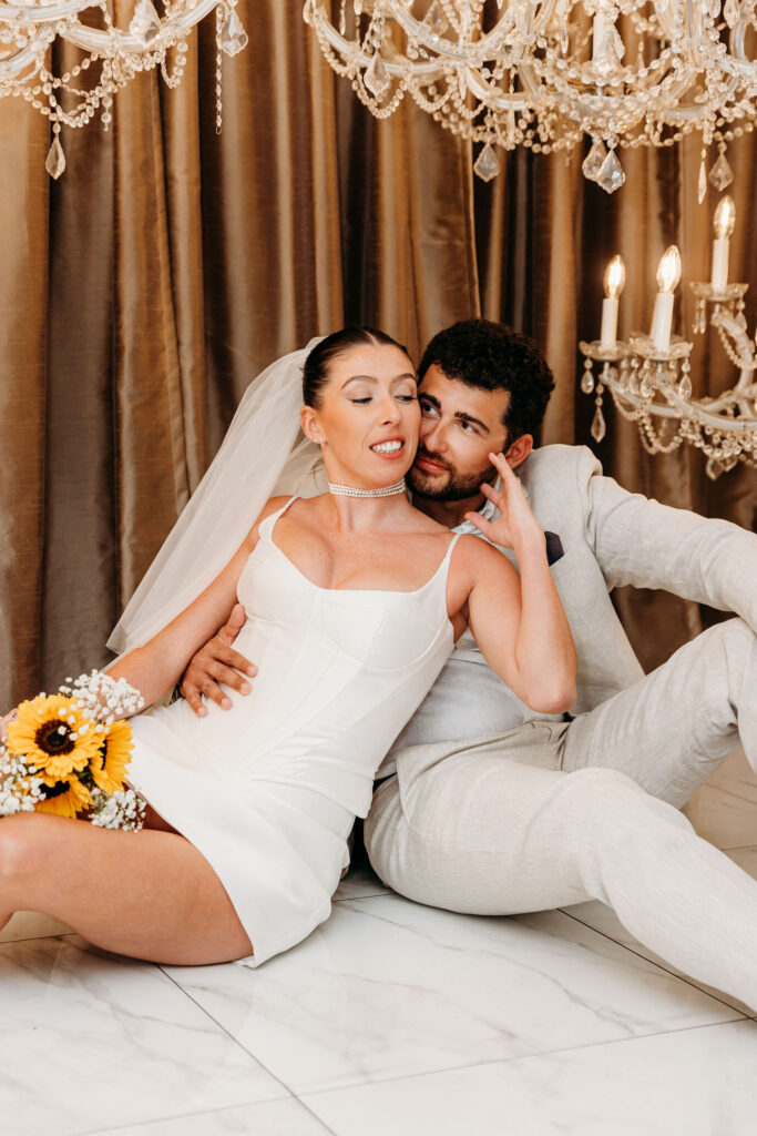 groom kissing the bride on the cheek