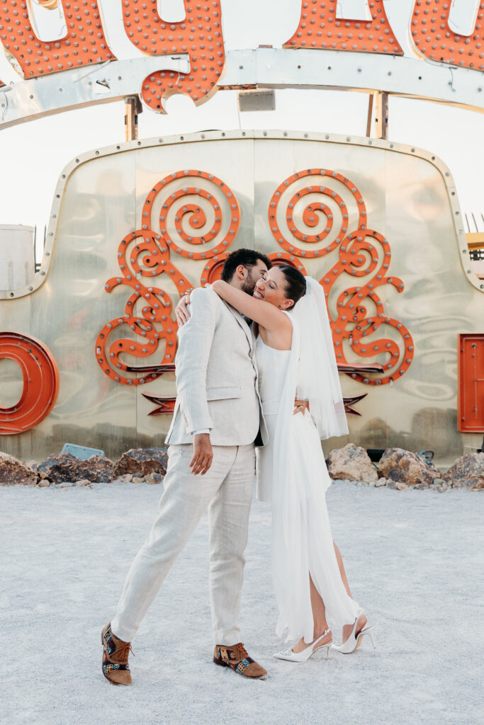 groom kissing the bride on the cheek