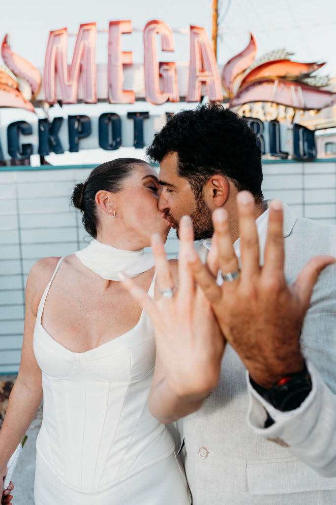 portrait of the couple showing their wedding rings