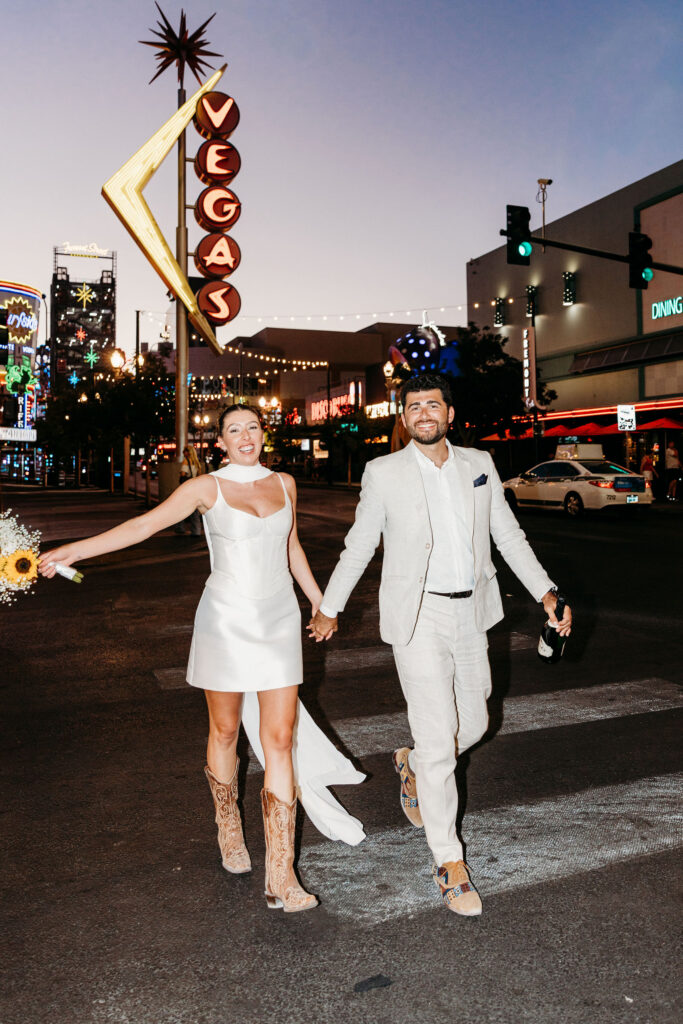 newlyweds celebrating in downtown fremont street