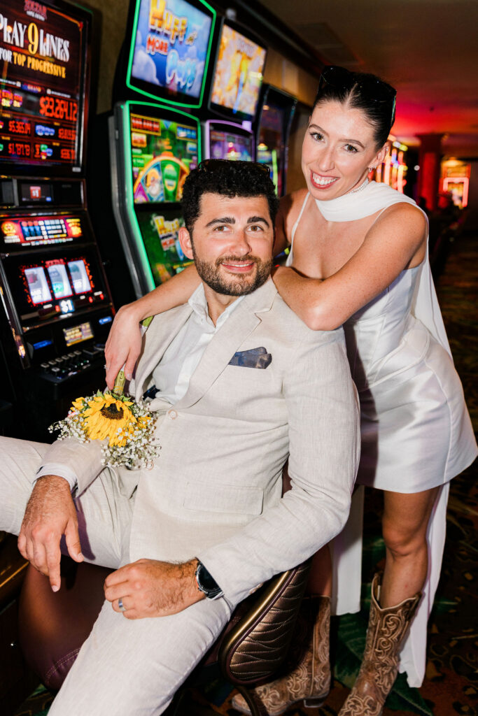 newlyweds smiling at the camera during their photoshoot