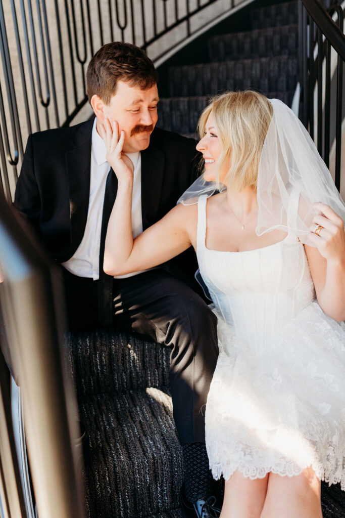 cute picture of the bride and groom smiling at each other